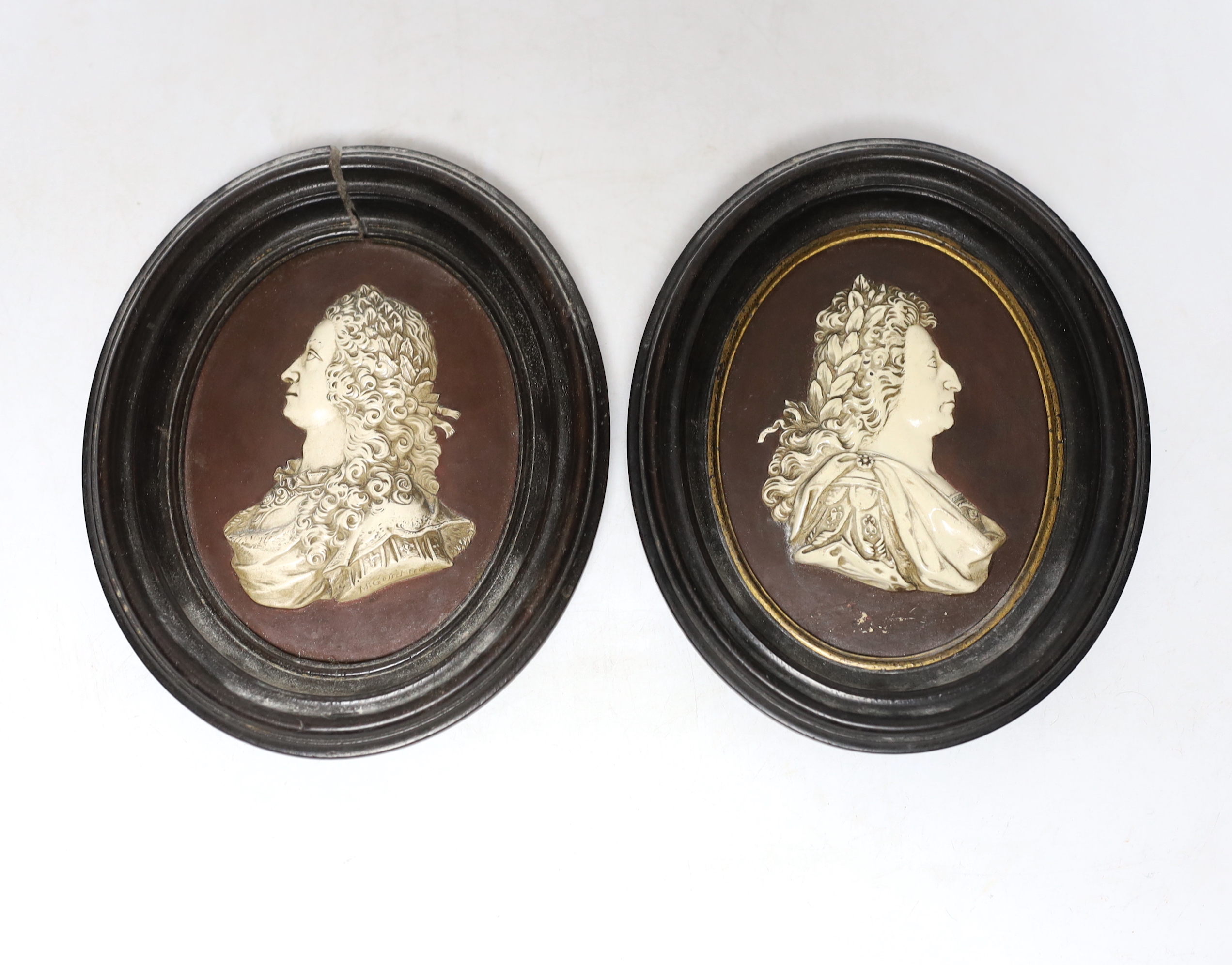 After Isaac Gosset, a pair of oval cream glazed terracotta portrait plaques of George II and George III?, 10cm high not including frames